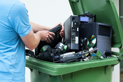 Muck away professionals assessing waste removal needs