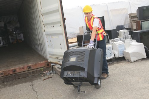 Workers sorting construction debris for recycling